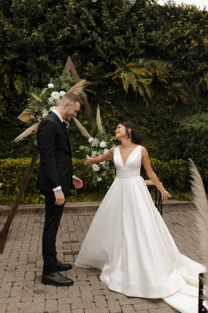 First look with bride and groom in courtyard at 5eleven palafox