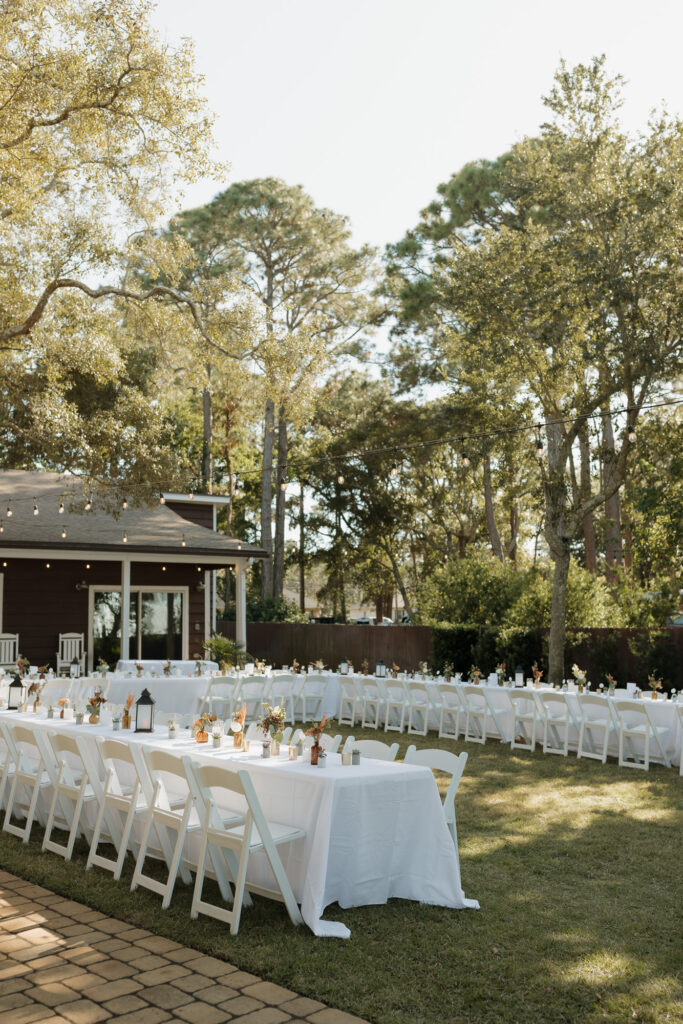 Moody tablescape with florals and candlelight at Florida waterfront wedding