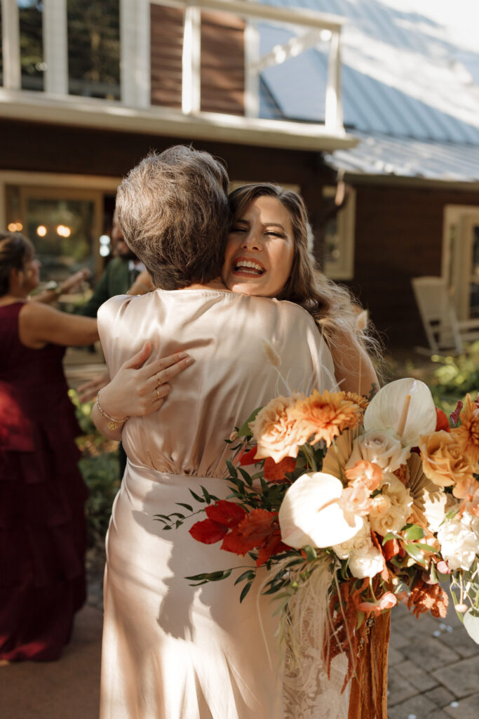 Emotional family embrace just after the ceremony at Bayfront Lodge
