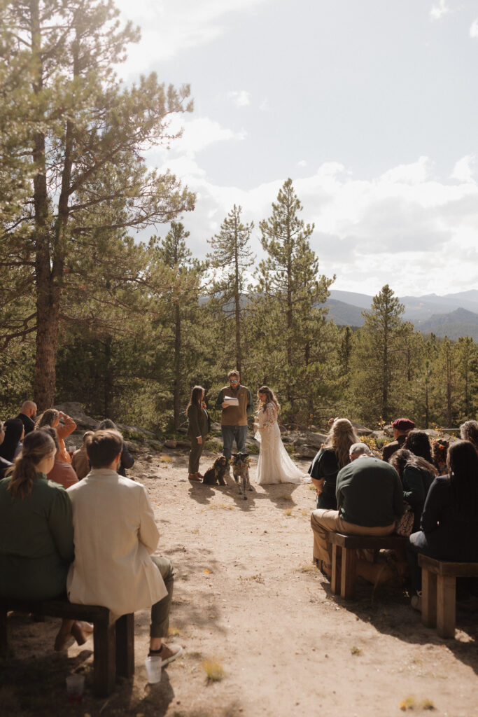 LGBTQ wedding ceremony at Blue Sky Mountain Ranch with fall mountain views