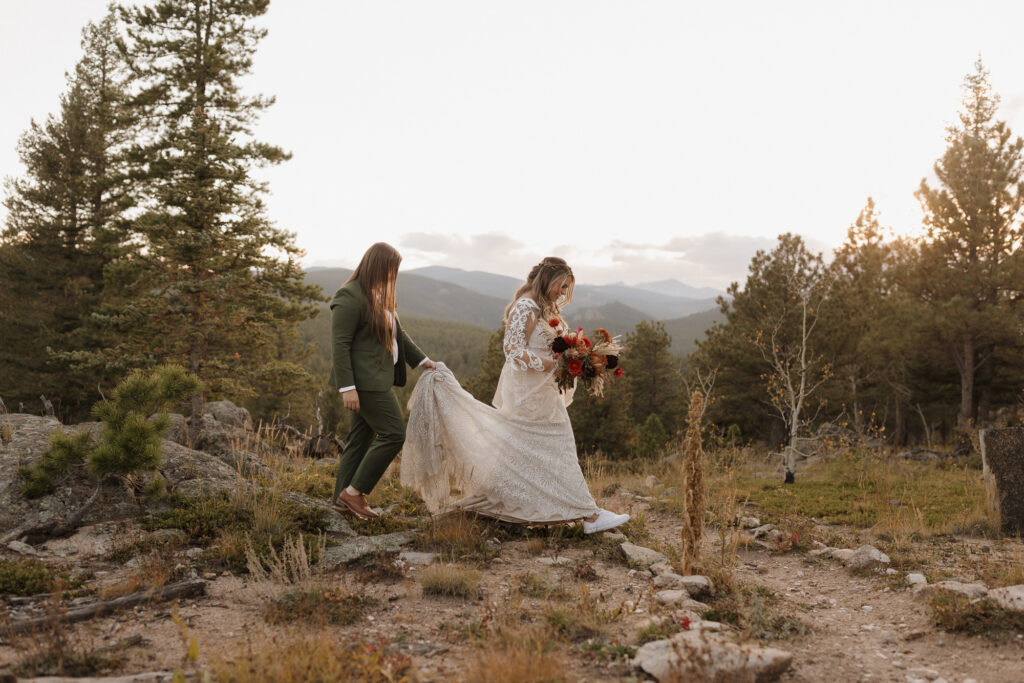 Couple embracing at golden hour during LGBTQ wedding in Colorado