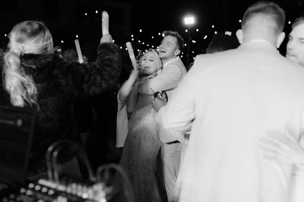bride and groom dancing with guests at reception at monet monet wedding venue in 30a