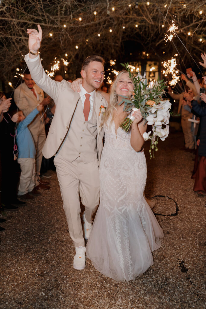 bride and groom sparkler exit at monet monet outdoor wedding venue