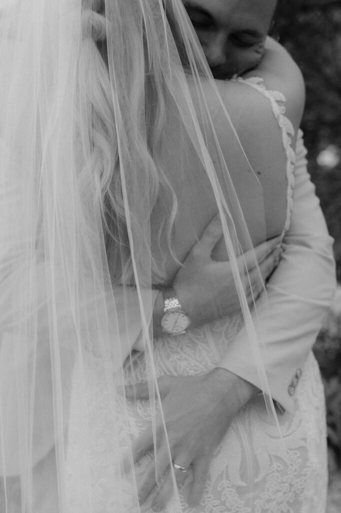 Intimate 30A wedding moment with emotional embrace at Monet Monet venue