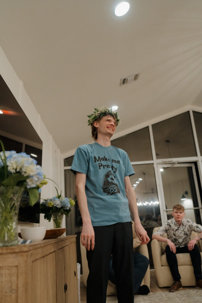 bride and groom and guests playing charades at small wedding