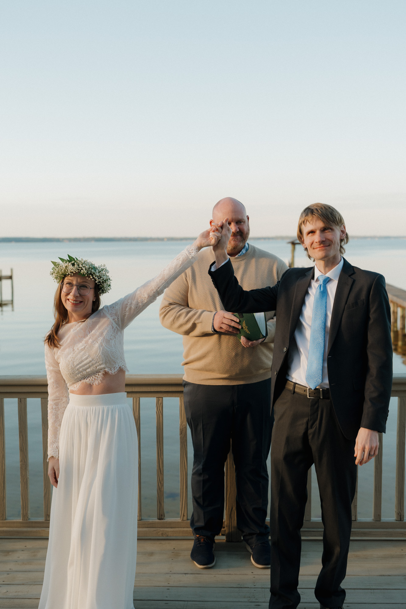 bride and groom celebrating after ceremony at outdoor dockside wedding in perdido key florida